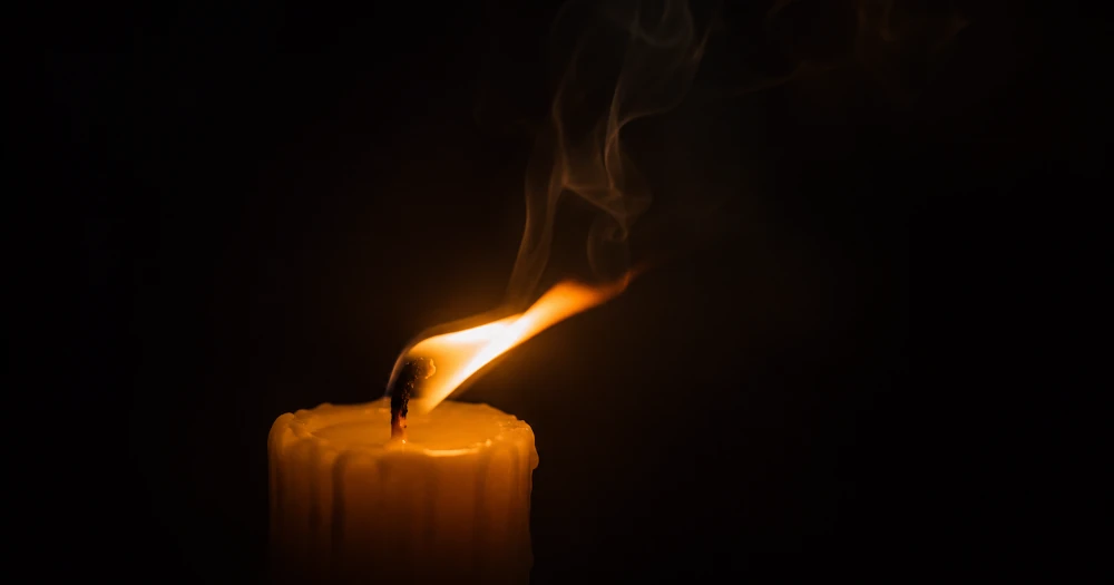 Candle flame flickering in a draft, a metaphor for the body's false alarm during a panic attack